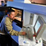 Chris Figgatt, a production engineer at RCBI, working with electronic operating systems for 3-D printing.